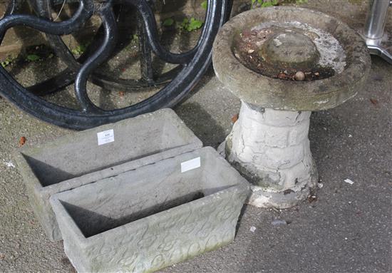 2 planters and a bird bath